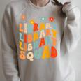 Library Squad Team Librarian Teacher Book Lover Retro Groovy Raglan Sleeve Sweatshirt Heather Forest