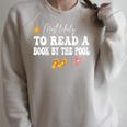 Most Likely To Read a Book By The Pool Raglan Sleeve Sweatshirt Heather Forest