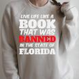 Live Life Like A Book Banned In The State Of Florida Raglan Sleeve Sweatshirt Heather Forest Live Life Like A Book Banned In The State Of Florida Raglan Sleeve Sweatshirt Heather Forest