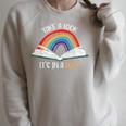 Take A Look It's In A Book Rainbow Bookworm Book Lover Raglan Sleeve Sweatshirt Heather Forest
