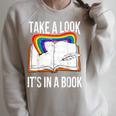 Take A Look It's In A Book Rainbow Bookworm And Book Lover Raglan Sleeve Sweatshirt Heather Forest