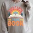 Take A Look It's In A Book Retro Reading Book Lover Premium Tri-Blend Raglan Sleeve Sweatshirt Heather Forest