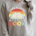 Take A Look It's In A Book Retro Reading Premium Tri-Blend Raglan Sleeve Sweatshirt Heather Forest