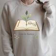 Lost In Stories Aesthetic Book And Growing Plant Tee Raglan Sleeve Sweatshirt Heather Forest