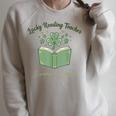 Lucky Reading Teacher Shamrocks And Stories Book Women Men Raglan Sleeve Sweatshirt Heather Forest Lucky Reading Teacher Shamrocks And Stories Book Women Men Raglan Sleeve Sweatshirt Heather Forest