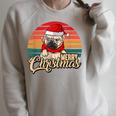 Merry Christmas Retro Vintage Pugmas Pug Reading Books Raglan Sleeve Sweatshirt Heather Forest