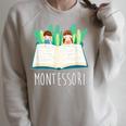 Montessori Learning Teacher Student Reading Books For Men Women Kids Raglan Sleeve Sweatshirt Heather Forest