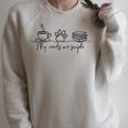 My Needs Are Simple Coffee Dog Paw Books Cozy Reading Lover Premium Tri-Blend Raglan Sleeve Sweatshirt Heather Forest