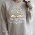 A New Chapter Begins Retired 2026 Floral Book Retirement Raglan Sleeve Sweatshirt Heather Forest A New Chapter Begins Retired 2026 Floral Book Retirement Raglan Sleeve Sweatshirt Heather Forest