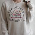 A New Chapter Retired 2026 Begins Retirement Wildflower Book Raglan Sleeve Sweatshirt Heather Forest A New Chapter Retired 2026 Begins Retirement Wildflower Book Raglan Sleeve Sweatshirt Heather Forest