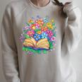 Open Book Surrounded By Colorful Spring Flowers Bloom Raglan Sleeve Sweatshirt Heather Forest