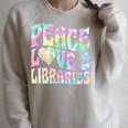 Peace Love And Libraries Heart And Books Graphic Premium Tri-Blend Raglan Sleeve Sweatshirt Heather Forest