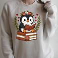 Penguin Reading Book Graphic Penguin With Book Floral Raglan Sleeve Sweatshirt Heather Forest