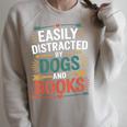 Pet Lover Joke Easily Distracted By Dogs And Books Men Raglan Sleeve Sweatshirt Heather Forest