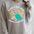 Plant a Seed Read Summer Reading 2026 Butterfly Book Floral Raglan Sleeve Sweatshirt Heather Forest