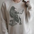Raven Crow Reading a Magic Book Wizard Animal Bird Reader Raglan Sleeve Sweatshirt Heather Forest