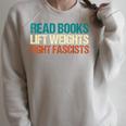 Read Books Lift Weights Fight Fascists Reading Men Women Raglan Sleeve Sweatshirt Heather Forest