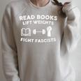 Read Books Lift Weights Fight Fascists Women Retro Men Raglan Sleeve Sweatshirt Heather Forest Read Books Lift Weights Fight Fascists Women Retro Men Raglan Sleeve Sweatshirt Heather Forest
