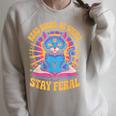 Read Books Be Weird Stay Feral Cat Groovy Raglan Sleeve Sweatshirt Heather Forest Read Books Be Weird Stay Feral Cat Groovy Raglan Sleeve Sweatshirt Heather Forest