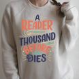 A Reader Lives A Thousand Lives Before He Dies Book Lover Raglan Sleeve Sweatshirt Heather Forest