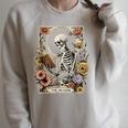 The Reader Tarot Card Skeleton Reading Book Raglan Sleeve Sweatshirt Heather Forest