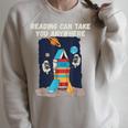 Reading Can Take You Anywhere Astronaut Book Lover Teacher For Men Women Kids Raglan Sleeve Sweatshirt Heather Forest