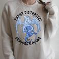 Reading Easily Distracted By Dragons & Books Lover Bookworm Raglan Sleeve Sweatshirt Heather Forest