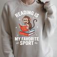 Reading Is My Favorite Sport Cute Monkey Reading Books Raglan Sleeve Sweatshirt Heather Forest