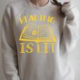 Reading Is Lit Book Reading Literary Pun Joke Premium Tri-Blend Raglan Sleeve Sweatshirt Heather Forest
