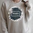 Reading Is A Ticket To Adventure Book Lover Reading Teacher Raglan Sleeve Sweatshirt Heather Forest