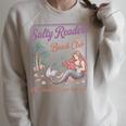 Salty Readers Beach Club Books Plot Twists & Sea Breezes Raglan Sleeve Sweatshirt Heather Forest Salty Readers Beach Club Books Plot Twists & Sea Breezes Raglan Sleeve Sweatshirt Heather Forest