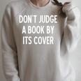 Sarcastic Don't Judge A Book By It's Cover Joke Raglan Sleeve Sweatshirt Heather Forest Sarcastic Don't Judge A Book By It's Cover Joke Raglan Sleeve Sweatshirt Heather Forest
