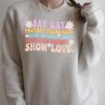 Say Gay Protect Trans Kids Read Banned Books LGBT Groovy Raglan Sleeve Sweatshirt Heather Forest
