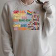 Say Gay Protect Trans Kids Read Banned Books LGBTQ Gay Pride Raglan Sleeve Sweatshirt Heather Forest