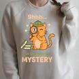 Shhh I'm Solving A Mystery Cat Detective Book Lover Raglan Sleeve Sweatshirt Heather Forest
