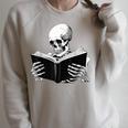Skeleton Reading Book Bookworm Reader Bookish Halloween Raglan Sleeve Sweatshirt Heather Forest Skeleton Reading Book Bookworm Reader Bookish Halloween Raglan Sleeve Sweatshirt Heather Forest