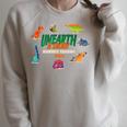Summer Reading 2026 Unearth A Story Dinosaurs Book Lover Raglan Sleeve Sweatshirt Heather Forest