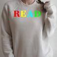Teacher Reading Read In Color Book Raglan Sleeve Sweatshirt Heather Forest