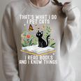 That's What I Do I Pet Cats I Read Books And I Know Things Raglan Sleeve Sweatshirt Heather Forest