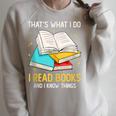 That's What I Do I Read Books And I Know Things Library Raglan Sleeve Sweatshirt Heather Forest