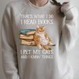 That's What I Do I Read Books I Pet Cats And I Know Things Raglan Sleeve Sweatshirt Heather Forest