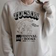 Tucson Festival Of Book TFOB 2024 Coatimundi Mascot Raglan Sleeve Sweatshirt Heather Forest