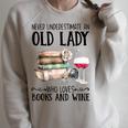 Never Underestimate An Old Lady Who Loves Books And Wine Raglan Sleeve Sweatshirt Heather Forest Never Underestimate An Old Lady Who Loves Books And Wine Raglan Sleeve Sweatshirt Heather Forest