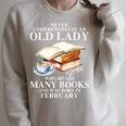 Never Underestimate An Old Lady Who Read Many Books February Raglan Sleeve Sweatshirt Heather Forest Never Underestimate An Old Lady Who Read Many Books February Raglan Sleeve Sweatshirt Heather Forest