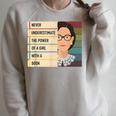 Never Underestimate The Power Of A Girl With A Book Feminist Raglan Sleeve Sweatshirt Heather Forest