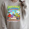 Unearth A Story Dinosaur Books Summer Reading 2026 Raglan Sleeve Sweatshirt Heather Forest Unearth A Story Dinosaur Books Summer Reading 2026 Raglan Sleeve Sweatshirt Heather Forest