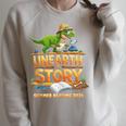 Unearth a Story Dinosaur Reading Books Summer 2026 Raglan Sleeve Sweatshirt Heather Forest