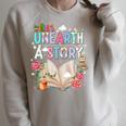 Unearth A Story Library Book Reading Program 2026 Summer Raglan Sleeve Sweatshirt Heather Forest