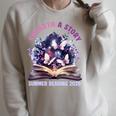 Unearth a Story Summer Library Reading 2026 Butterfly Book Raglan Sleeve Sweatshirt Heather Forest