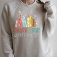 Unearth A Story Summer Reading 2026 Book Wildflowers Raglan Sleeve Sweatshirt Heather Forest Unearth A Story Summer Reading 2026 Book Wildflowers Raglan Sleeve Sweatshirt Heather Forest